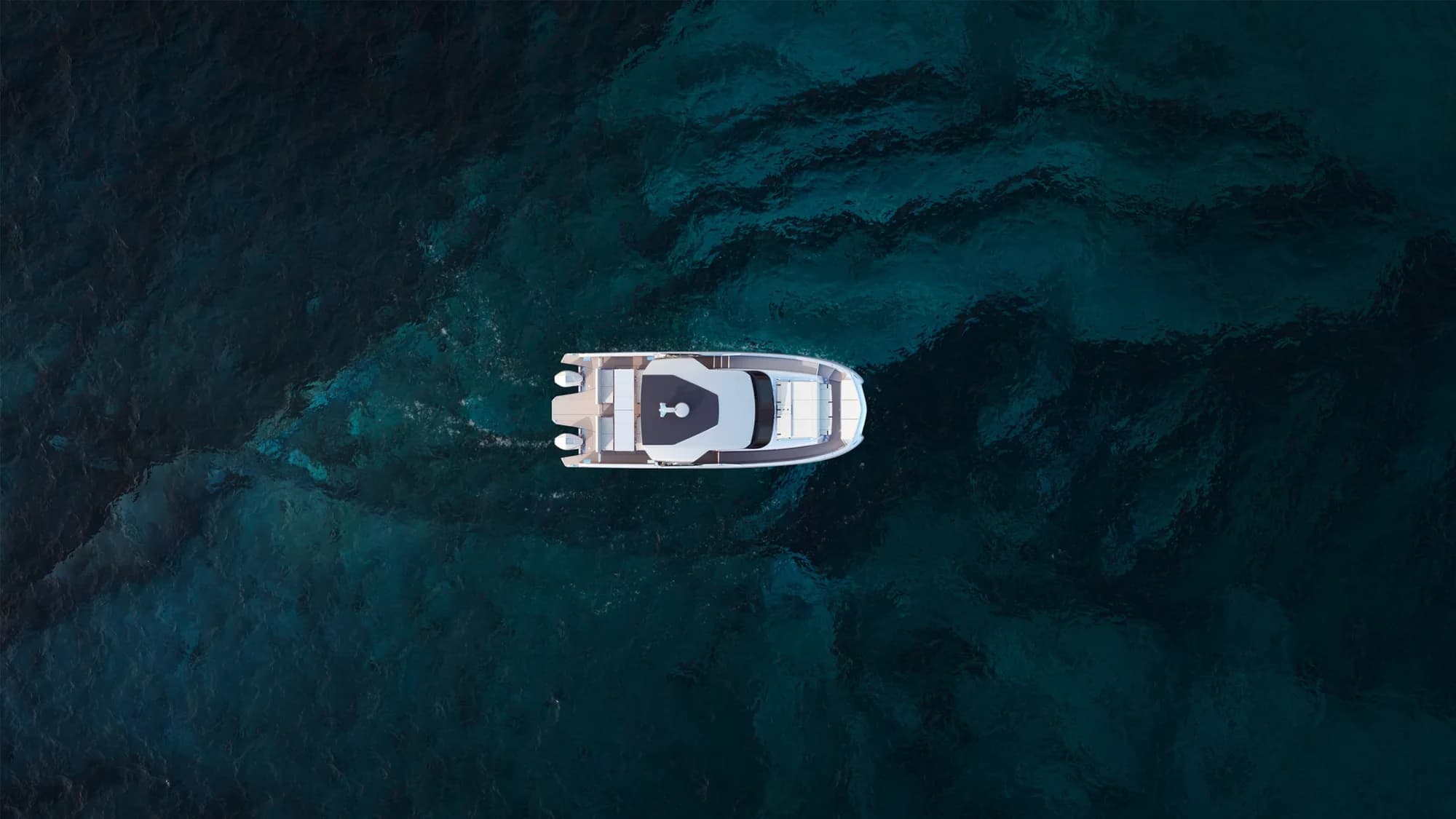 Power catamaran seen from directly above on clear water