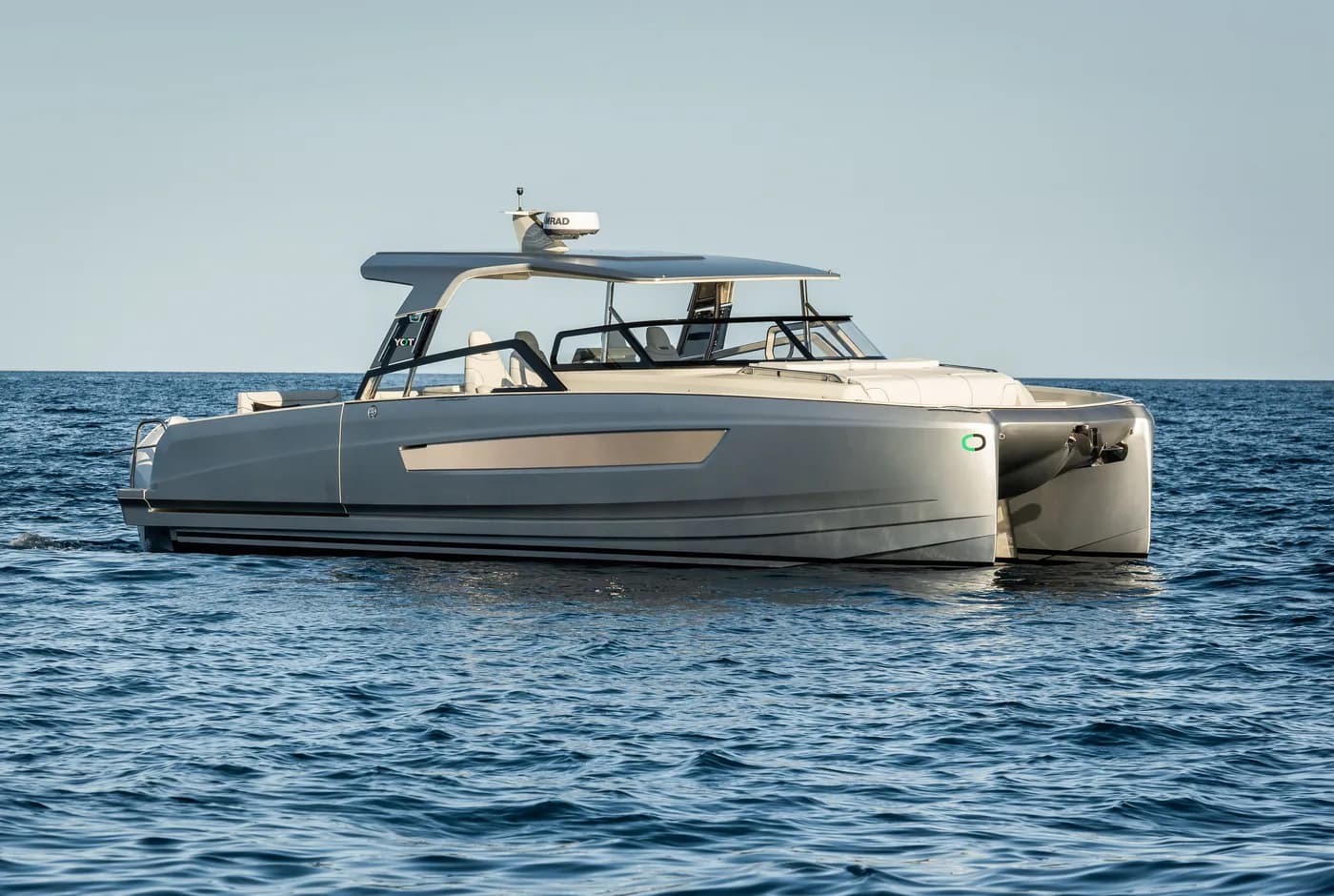 YOT power catamaran at rest on open water
